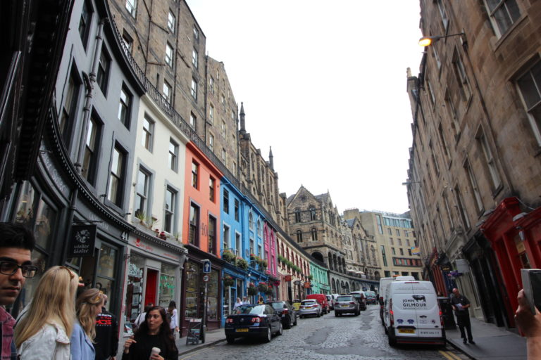 Colorful cobblestone streets of Edinburgh filled with medieval architecture