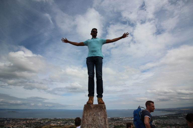 Standing on top of a pedestal at Arthur's Seat