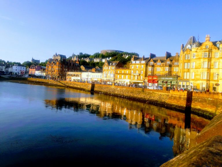 Sun sets over the lake in Oban Scotland