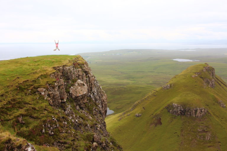 Jumping picture at the top of a hill in Quiraing