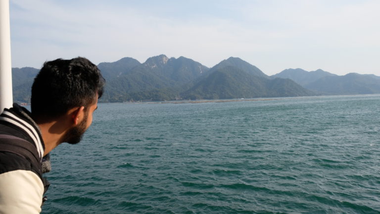 Looking at the river and mountains of Miyajima from the ferry