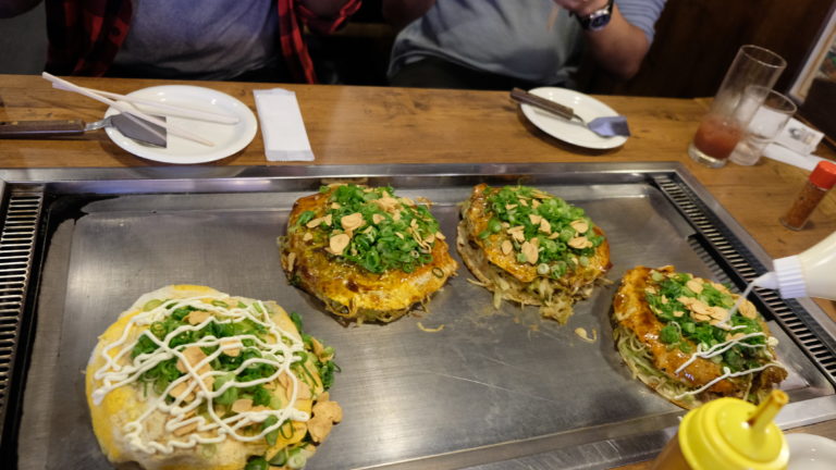 4 okonomiyaki japanes pancakes stay warm on a griddle