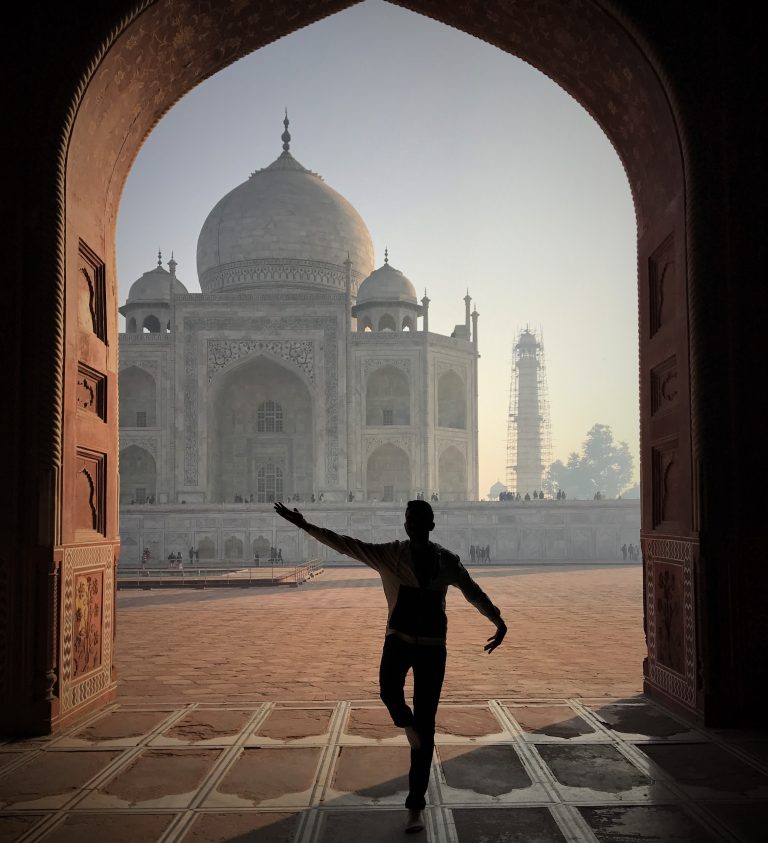 Shadow of a prayer pose infront of Taj Mahal