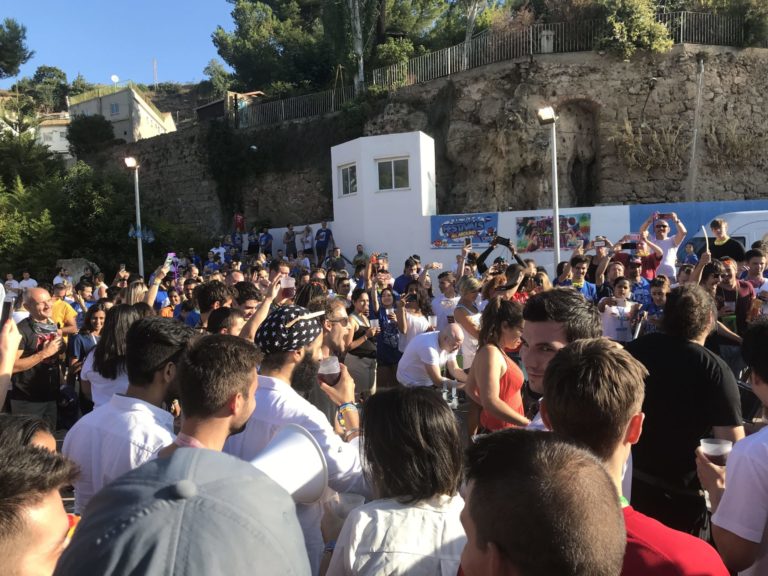 Group gathers around drummers at the La Tomatina Pre Party