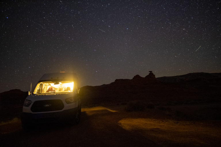 The van parked under the night sky in Utah