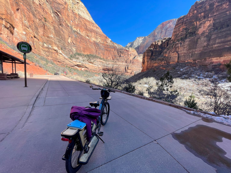 E-bike sits parked with Zion view in the background