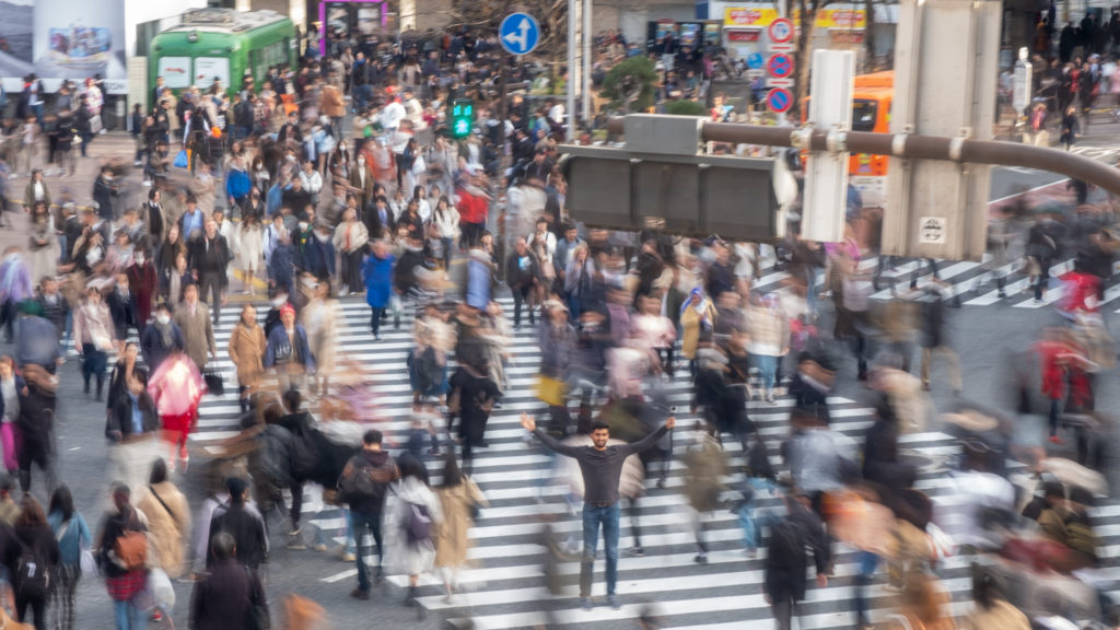 People Crossing at Shibuya Crossing as Nishil stands in the middle